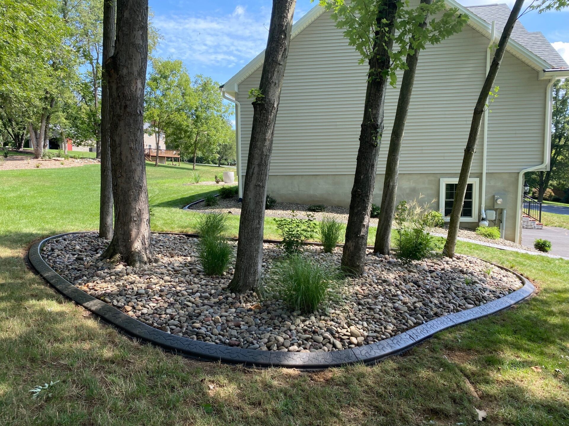 Landscape Curbing Mulch bed with custom concrete edging.